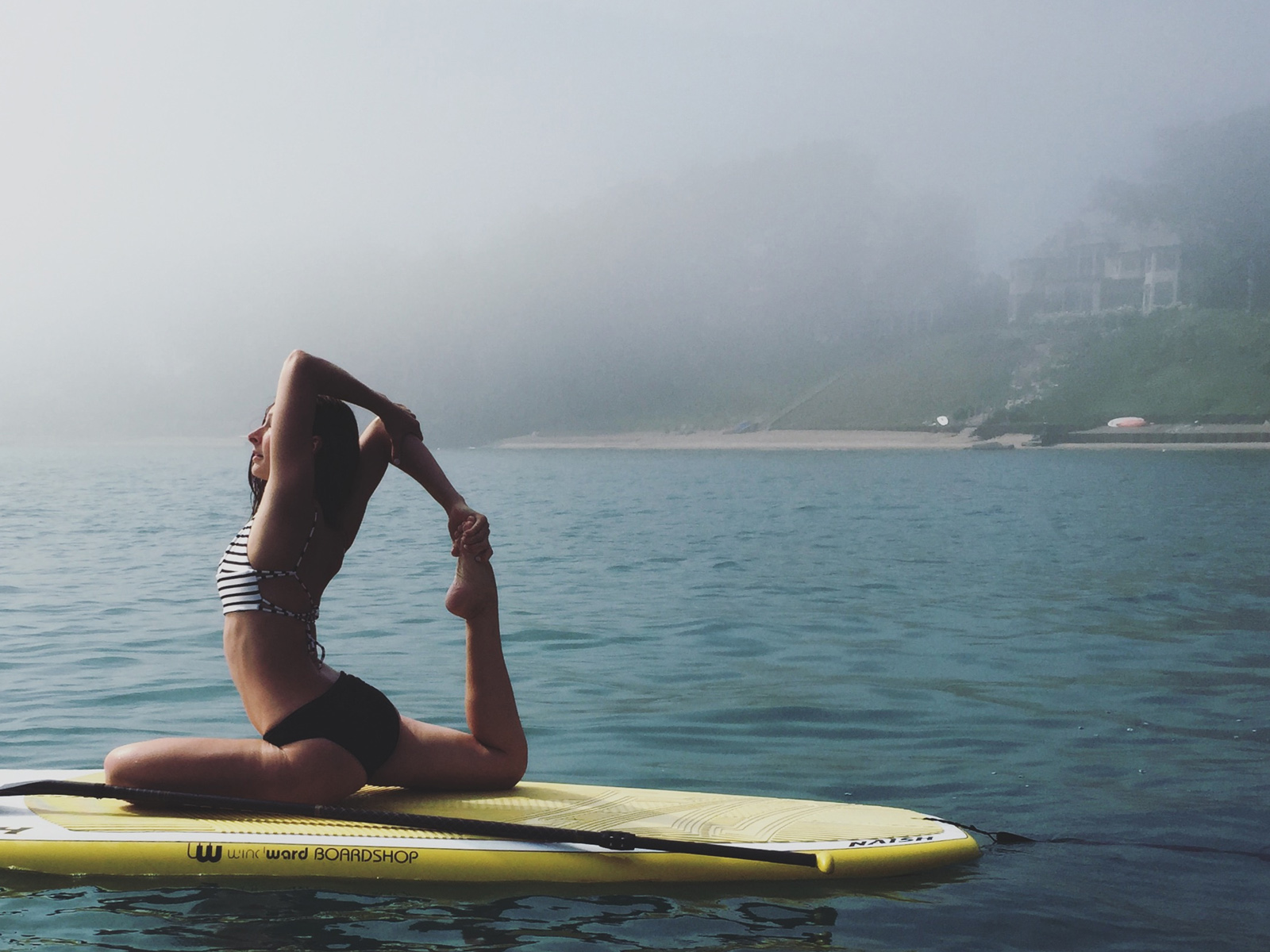SUP Yoga in fog and mist